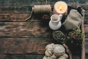 Witch doctor table with various dried ingridients above. Witchcraft concept background with copy...