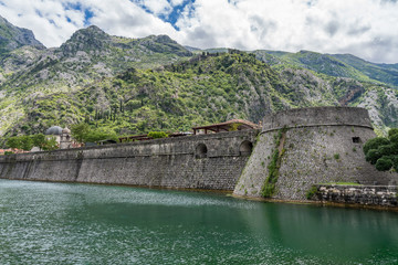 Solid stone walls surround the old town Kotor in Montenegro