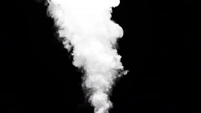 White clouds of vapor smoke are isolated on a black background. Gas explodes, swirl and dances in space. A magic fog dust texture effect that can be used by overlay and changing their transparency.