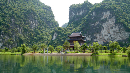 Fototapeta na wymiar Thanh Cao Son temple, landscape and background with a karst mountains, Trang An boat tour in Tam Coc, Vietnam.
