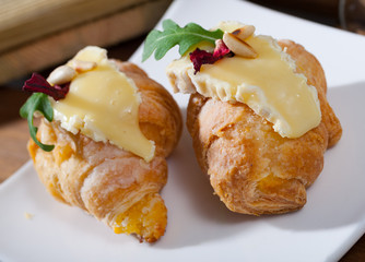 Croissant with Camembert and pine nuts
