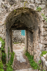 Fototapeta na wymiar Stone walls of Kotor Fortress above the old town in Montenegro