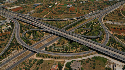 Naklejka premium Aerial photo of multilevel junction highway crossing with high speed national road at rush hour