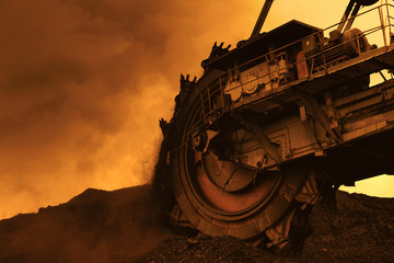 Giant bucket wheel excavator in coal mine at sunset © martinlisner