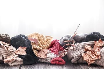 Cozy autumn morning breakfast in bed still life scene. Steaming cup of hot coffee, tea standing near window. Fall.