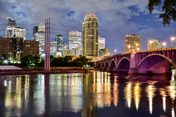 Fototapeta na wymiar urban skyline along the river at night