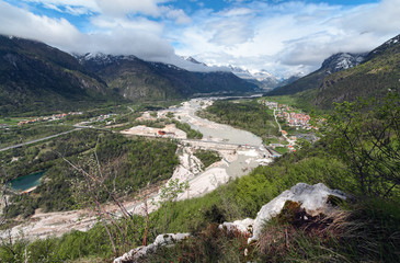 Fototapeta na wymiar High view the Piave river with the industrial area of Villanova
