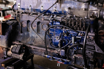Fototapeta premium Mechanic opened the locking valve mechanism. Disassemble engine block vehicle. Old motor capital repair. Car service concept