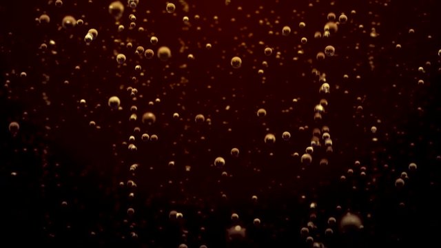 Transparent bubbles go up underwater over soda background