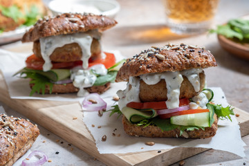 Gourmet Fish seafood burger with mayo and fresh vegetables