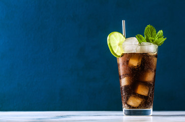 Coca Coke cocktail in a tall glass cuba libre. refreshing summer drink