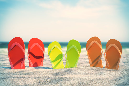 Colorful flip flops on beach
