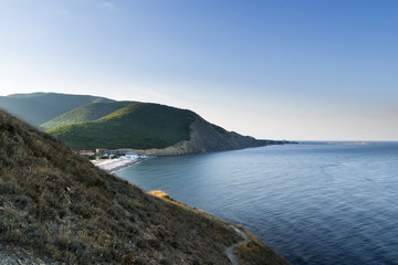 Fototapeta na wymiar Early morning. The view from the mountain with grass on the beach in the village of Sukko. Suburb of Anapa, Krasnodar region.