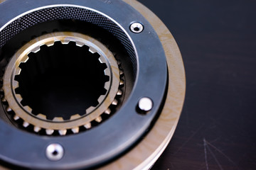 Mechanic repairs old motor of truck in a car repair station. Disassemble engine block vehicle. New details for motor. Car service concept