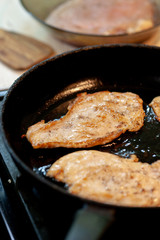 raw chicken meat on pan at kitchen. chicken chops. selective focus. cooking chops.