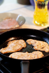 raw chicken meat on pan at kitchen. chicken chops. selective focus. cooking chops.