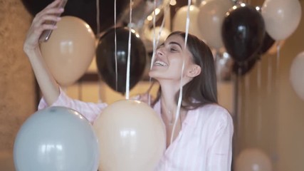 Young influencer streaming her milestone celebration live, medium shot