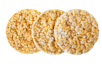 Caramelized corn cakes. Puffed whole grain crispbread isolated on white background. Close-up.
