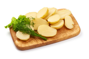 Boiled potato pieces on a cutting board, close-up, isolated on white background