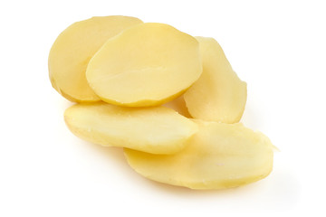 Boiled potato pieces, close-up, isolated on white background