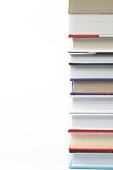 Books laid horizontally on a white background, aligned in a line