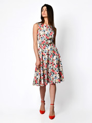 Young beautiful woman walking in new design casual summer long dress full body on white