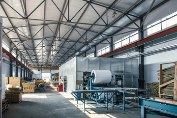 Automatic conveyor machinery line or belt for metal roll forming in industrial factory interior as industry background