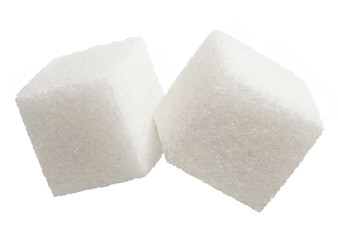 Close-up of two white sugar cubes, isolated on white background