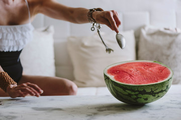 beautiful woman eating watermelon indoor