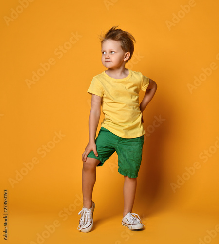 Young Boy Kid In Yellow T Shirt And 