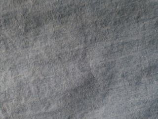 Shades of grey black colored fabric background
