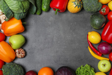 Variety of fresh delicious vegetables and fruits on table, flat lay. Space for text