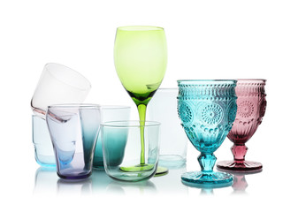 Set of different empty glasses on white background