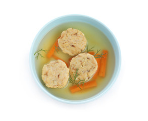 Bowl of Jewish matzoh balls soup isolated on white, top view