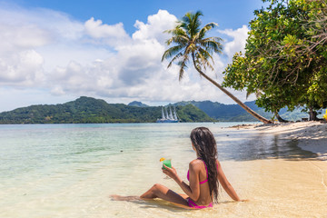 Tahiti cruise private beach island relaxing swimming in water sipping on blue Hawaiian cocktail...
