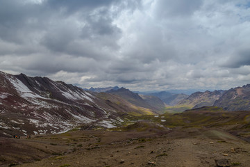 View of the incredible rainbow mountains outside of Cusco, Peru. The quantities are a variety of colors of mineral deposits in the soil