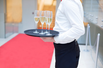 waiter serving drinks at red carpet gala event