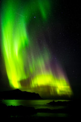 Obraz na płótnie Canvas Aurora borealis over the mountains of Lofoten, Norway.
