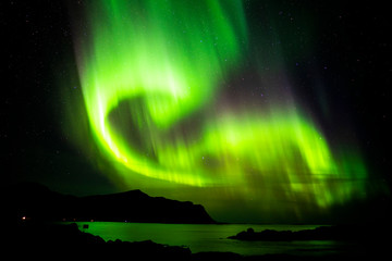 Aurora borealis over the mountains of Lofoten, Norway.