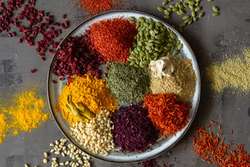 Colourful various herbs and spices for cooking on isolated background