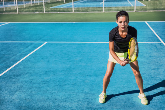 Tennis Player Woman Playing Doubles Game On Blue Hard Court In Outdoor Sports Club. Asian Girl Realdy To Play.