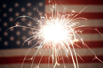USA American flag lit up by sparklers for 4th of July celebrations