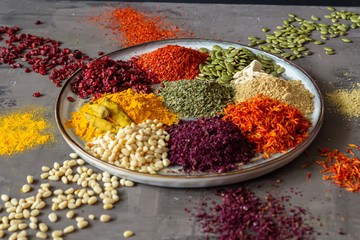 Colourful various herbs and spices for cooking on isolated background
