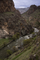 tmogvi ruins with mountain and river landscape