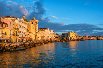 Fototapeta na wymiar Ischia town waterfront on sunset, Italy