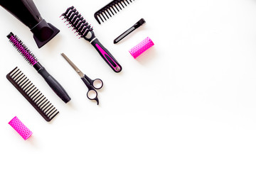 Set of professional hairdresser tools with combs and drier on white background top view mock up