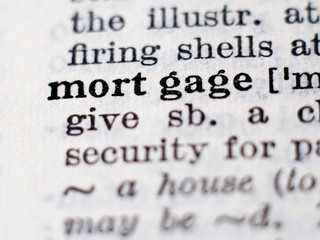 Dictionary definition of word mortgage. Selective focus.