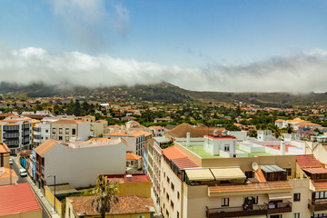Fototapeta premium Aerial view of the historic town of San Cristobal de La Laguna in Tenerife showing the buildings and streets with mountains in the background
