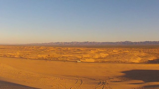 Distant Car On Highway Running Through Algodones Sand Dunes