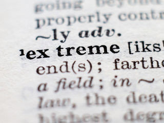 Dictionary definition of word extreme. Selective focus.
